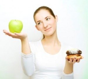 Woman Balancing Apple and Bagel