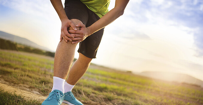 Man Holding Knee in Pain